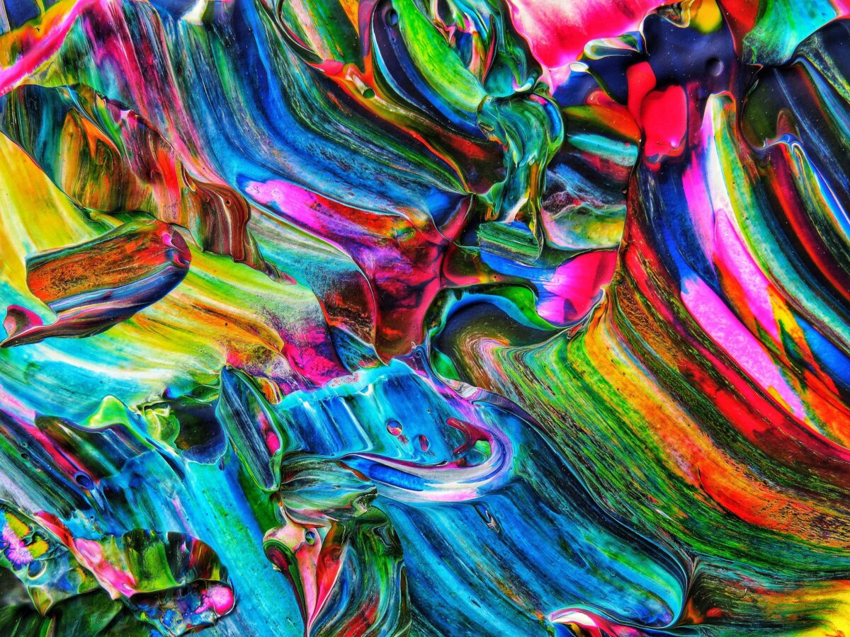 Colorful abstract design with vivid acrylic paint swirls creating a vibrant artistic pattern.